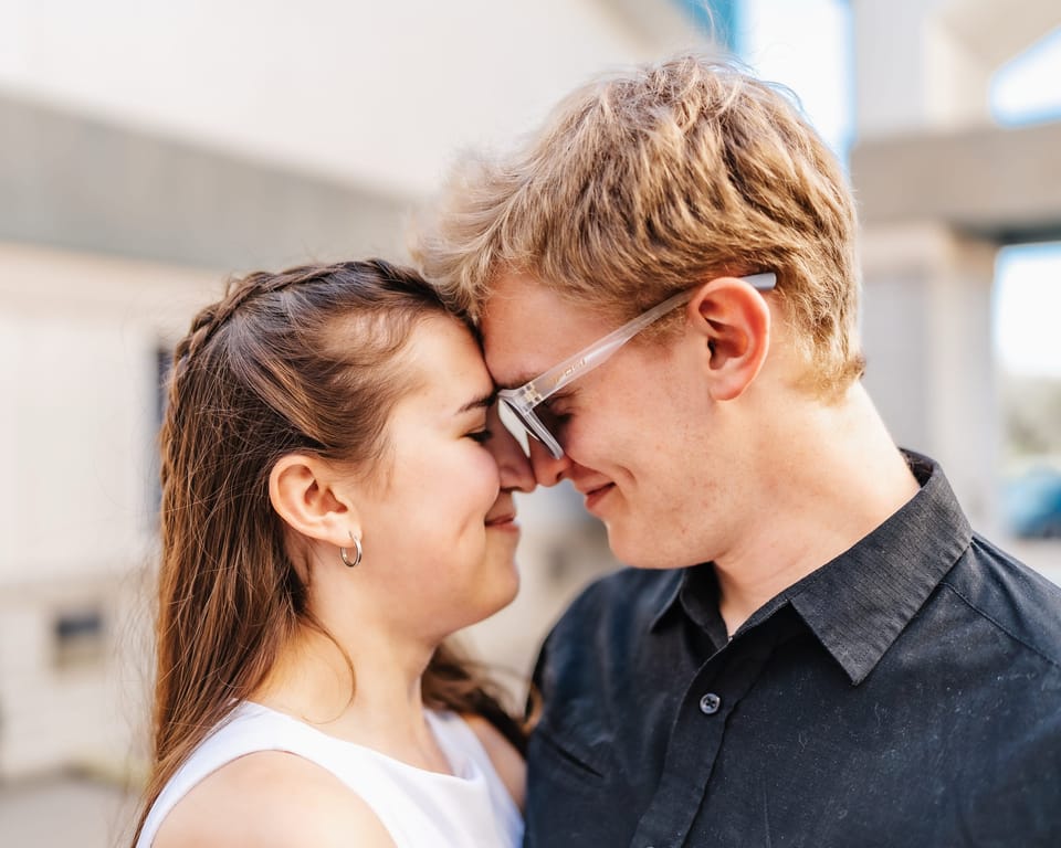 Couple resting their foreheads together and smiling