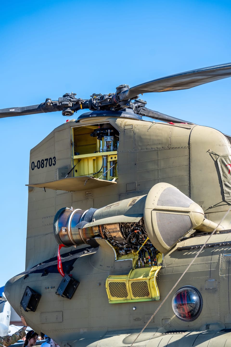 Nose of a Chinook helicopter under its rotor blades