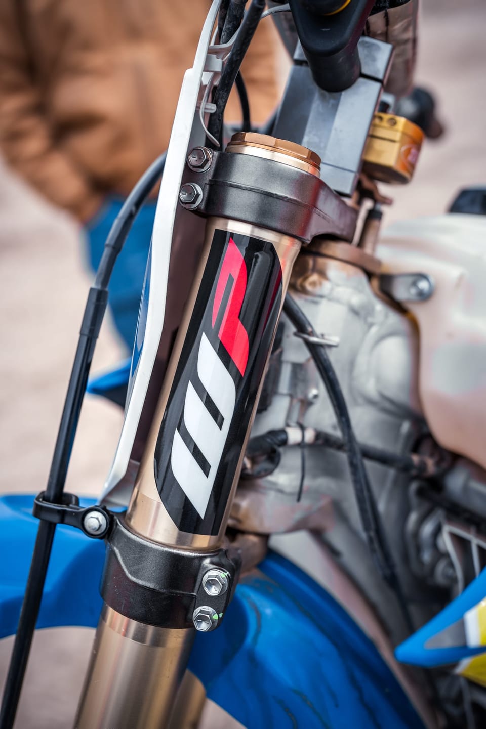 Close-up of a dirt bike's front suspension fork