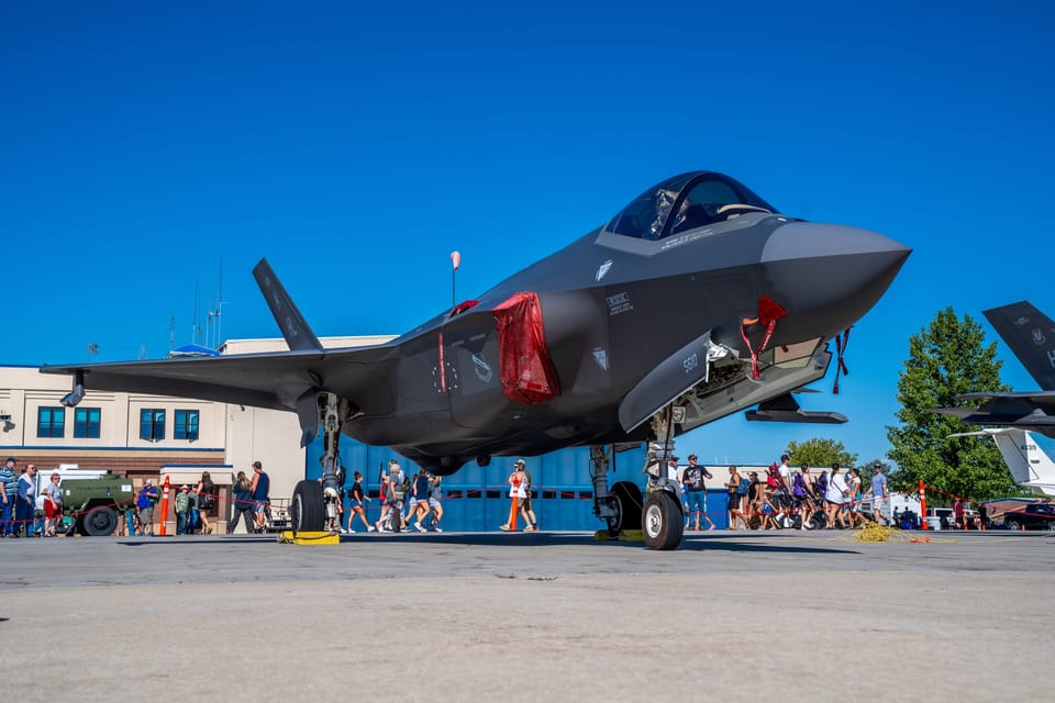F-35 fighter jet on display with an airshow crowd