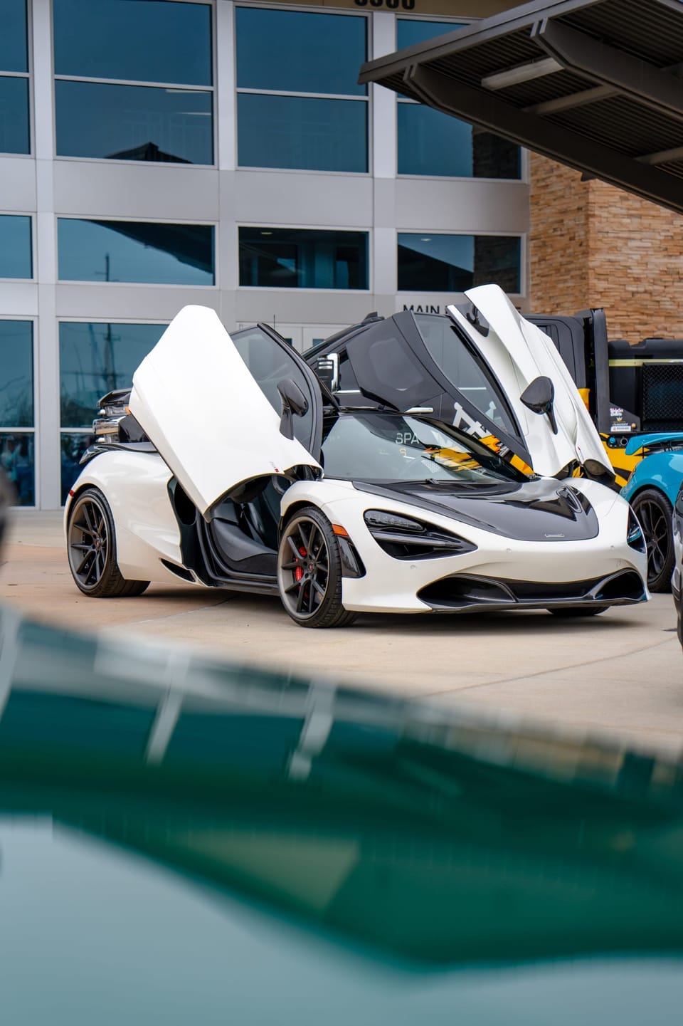 White McLaren with both doors raised