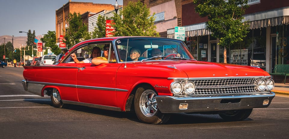 Red classic Chevrolet Impala on a downtown street