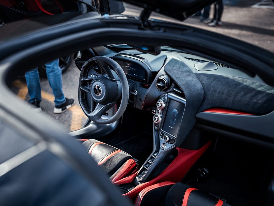 Cockpit of a supercar seen through the open door