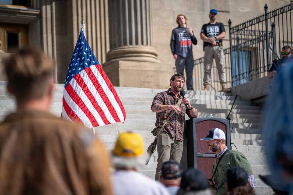 Speaker at a podium on the Idaho Capitol steps